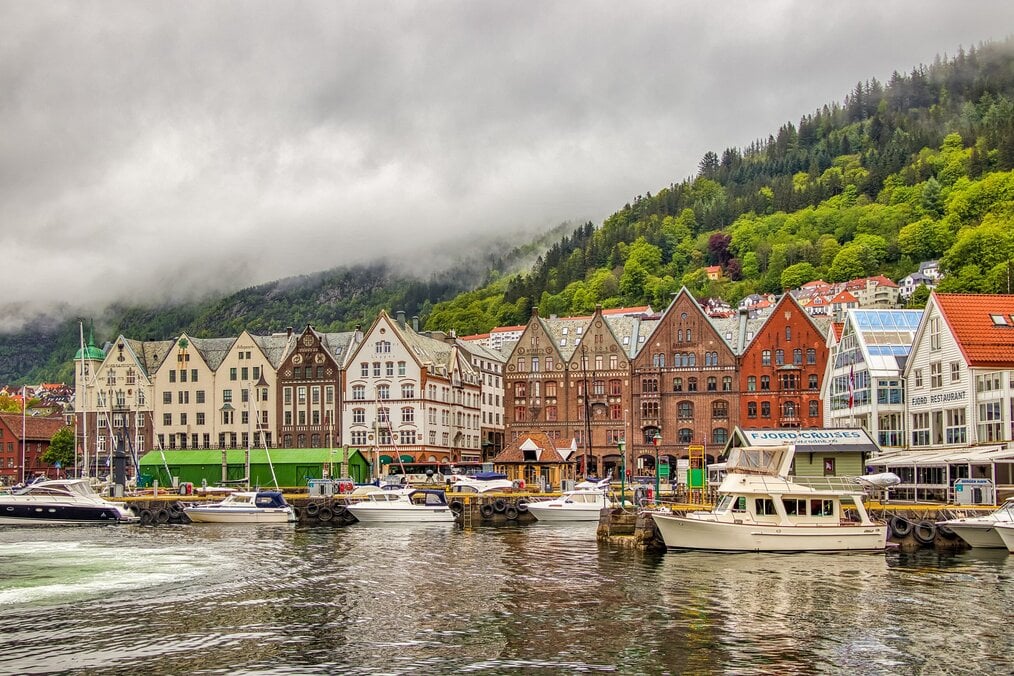 Photo by Andreas M on Unsplash Buildings along a river in Norway.