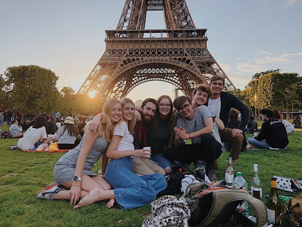 Jerra H. Germany, USAC A group of students pose in front of the Eiffel Tower in Paris.